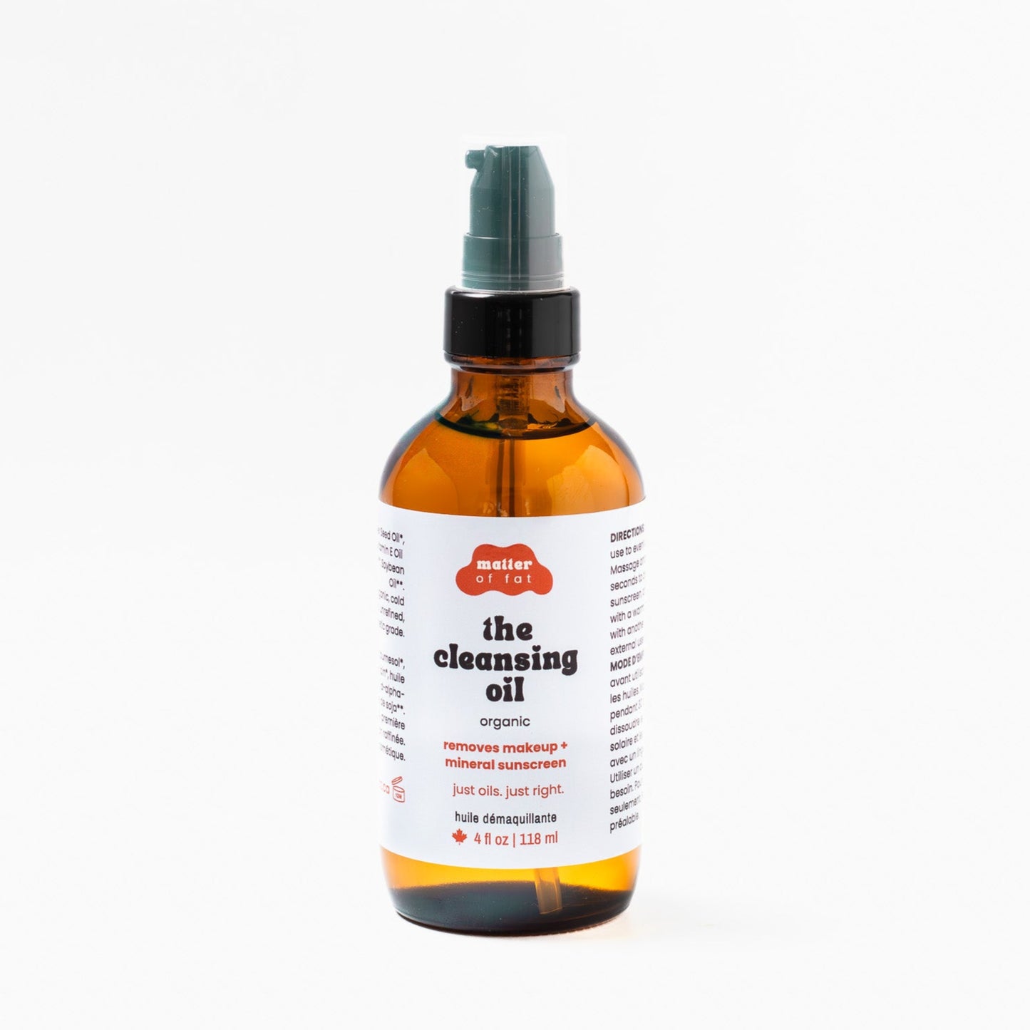 Amber 4 oz glass pump bottle of 'the cleansing oil' on a white background