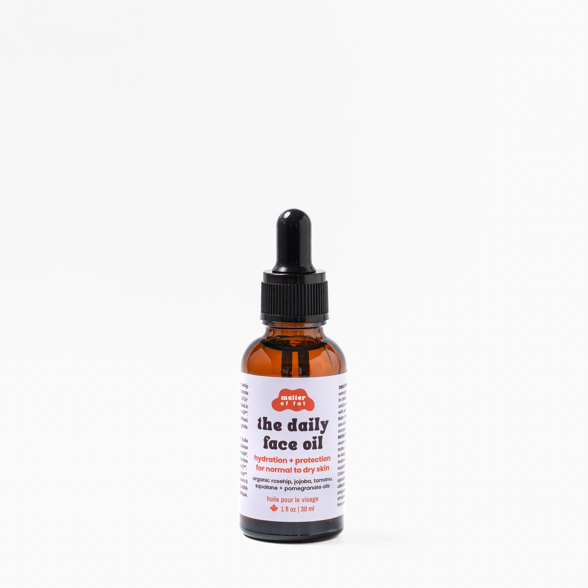 1 ounce glass dropper bottle of 'the daily face oil' on a white background