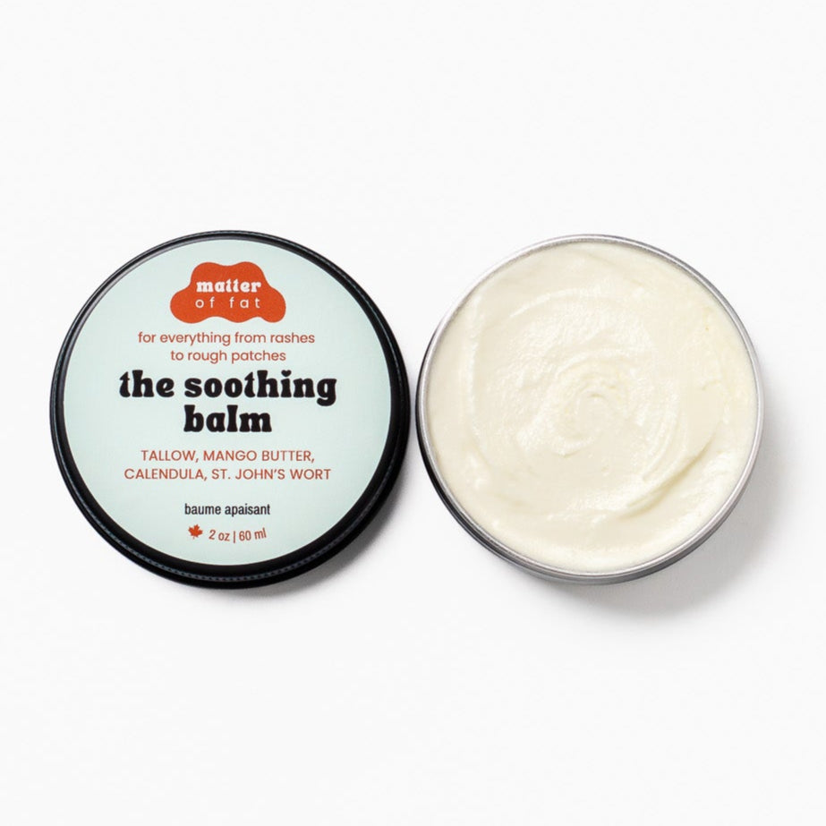 The soothing balm in a 2 ounce tin by Matter of Fat opened on a white background